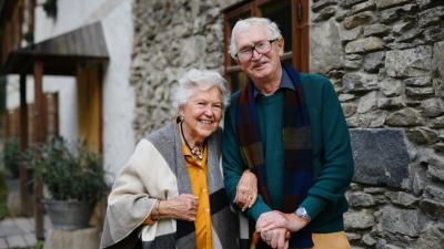 Happy senior couple posing near old countryside ho 2022 11 10 00 56 43 utc